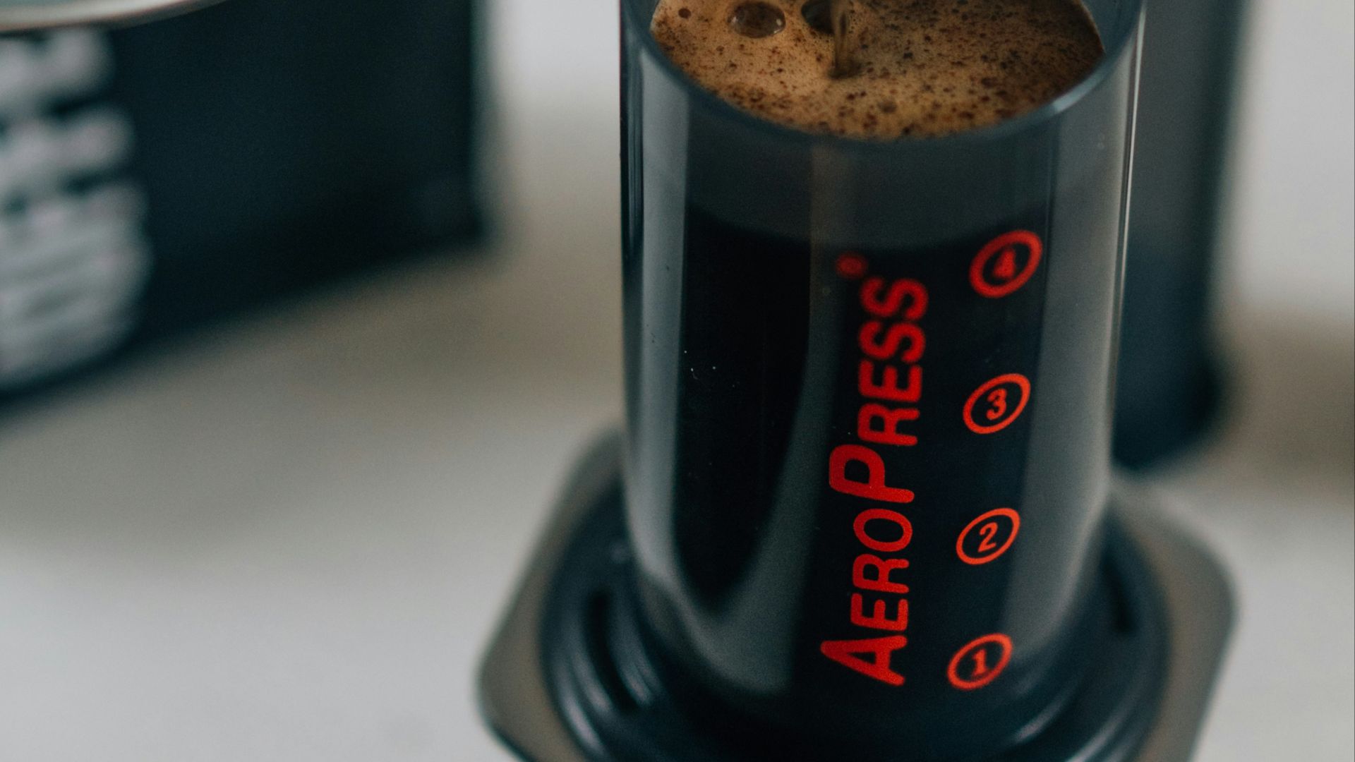 a coffee maker pouring a cup of coffee