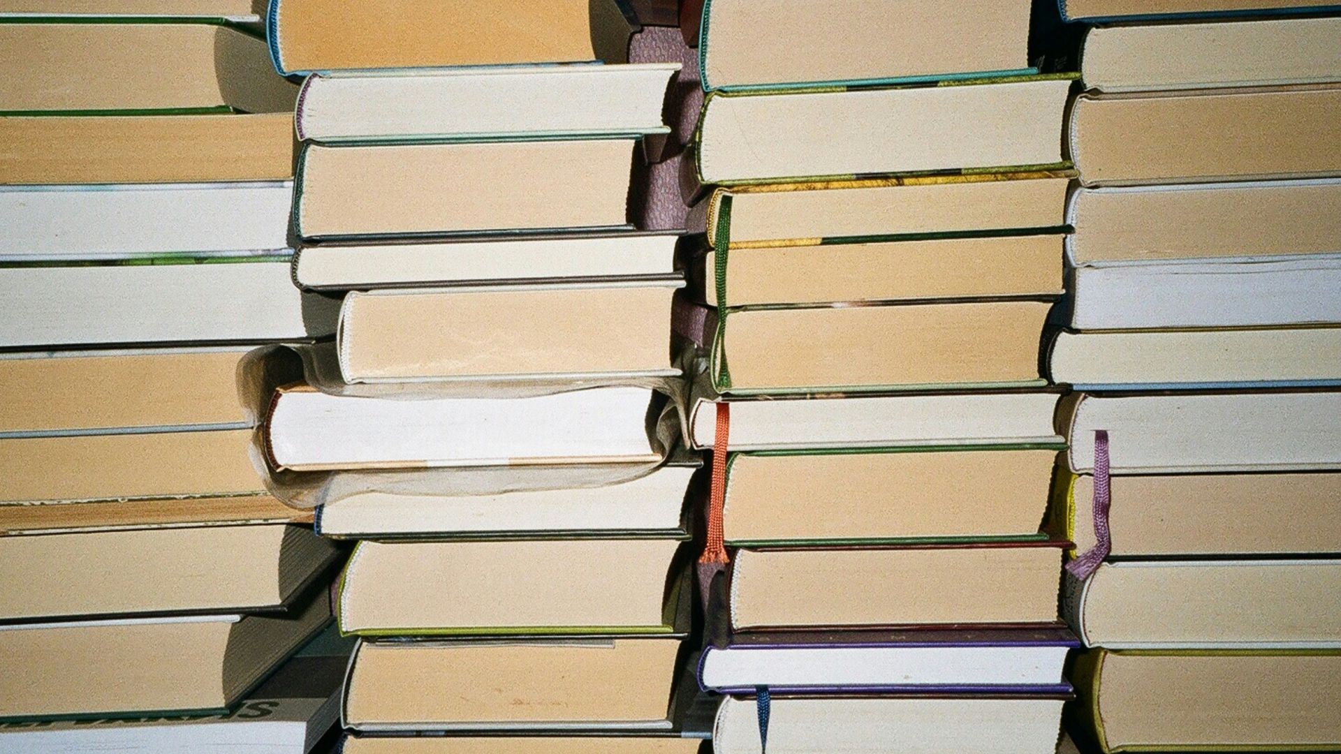 a stack of books sitting on top of each other