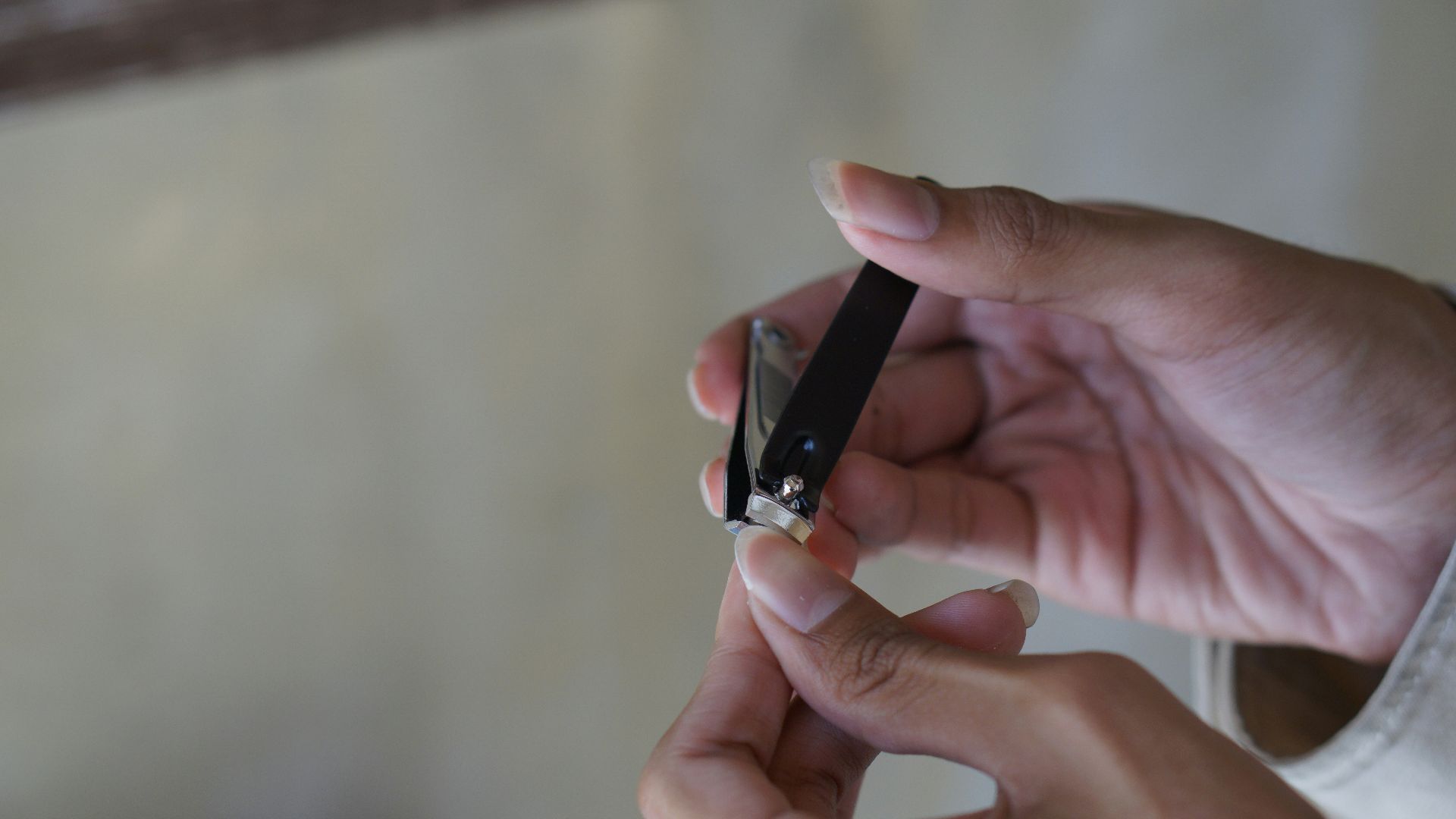 a person holding a cigarette in their hand