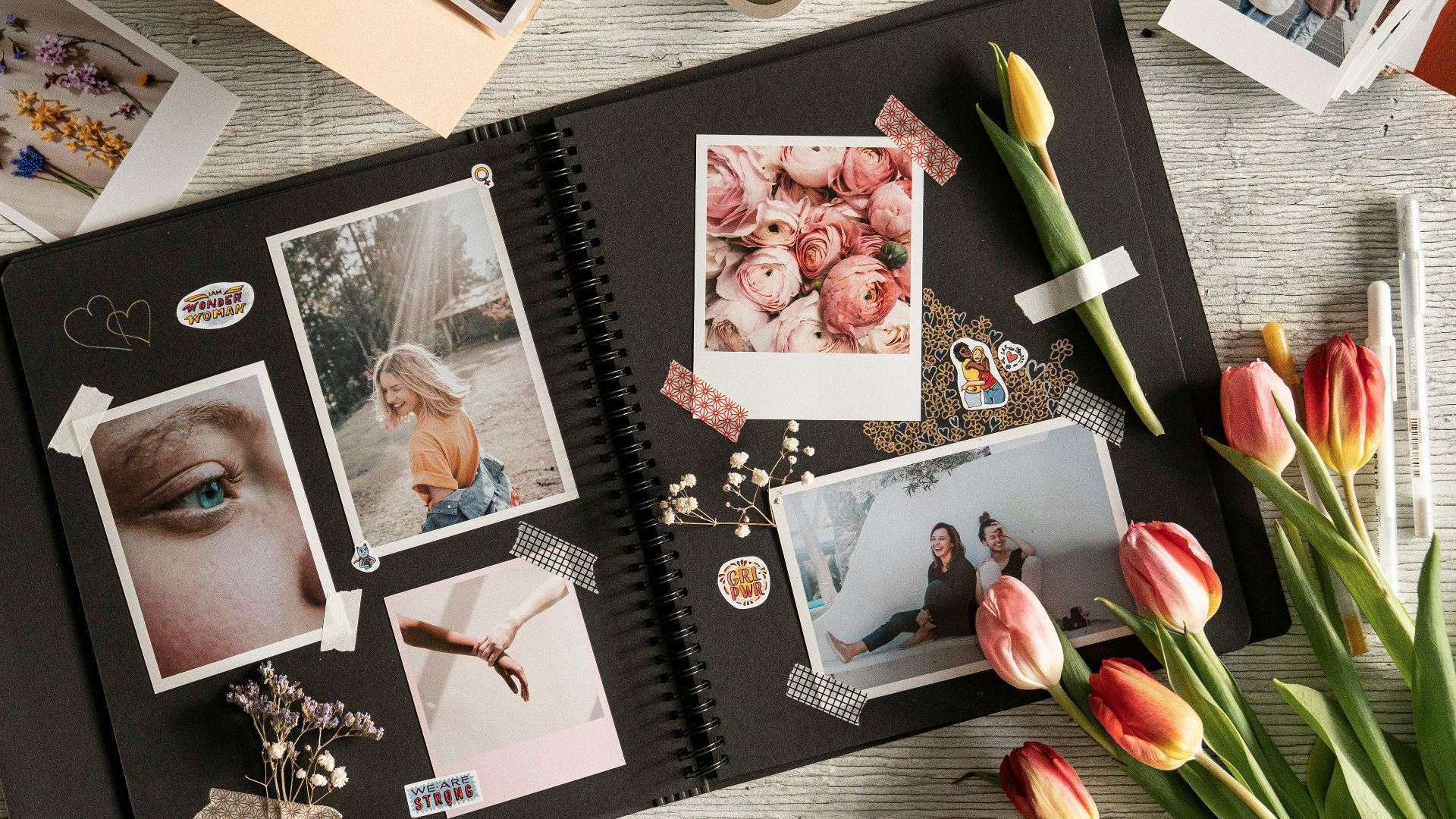 a bunch of pictures and flowers on a table
