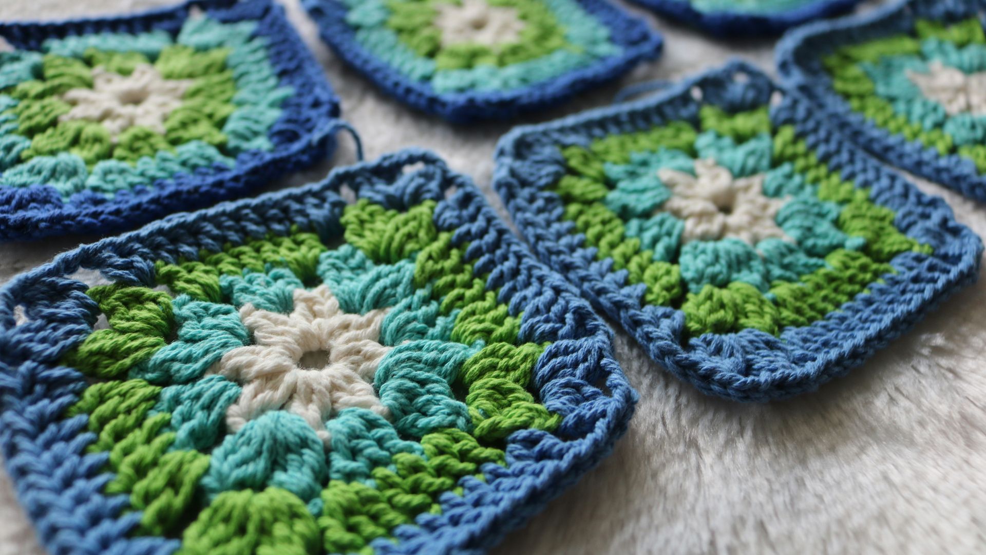 green white and yellow knit textile