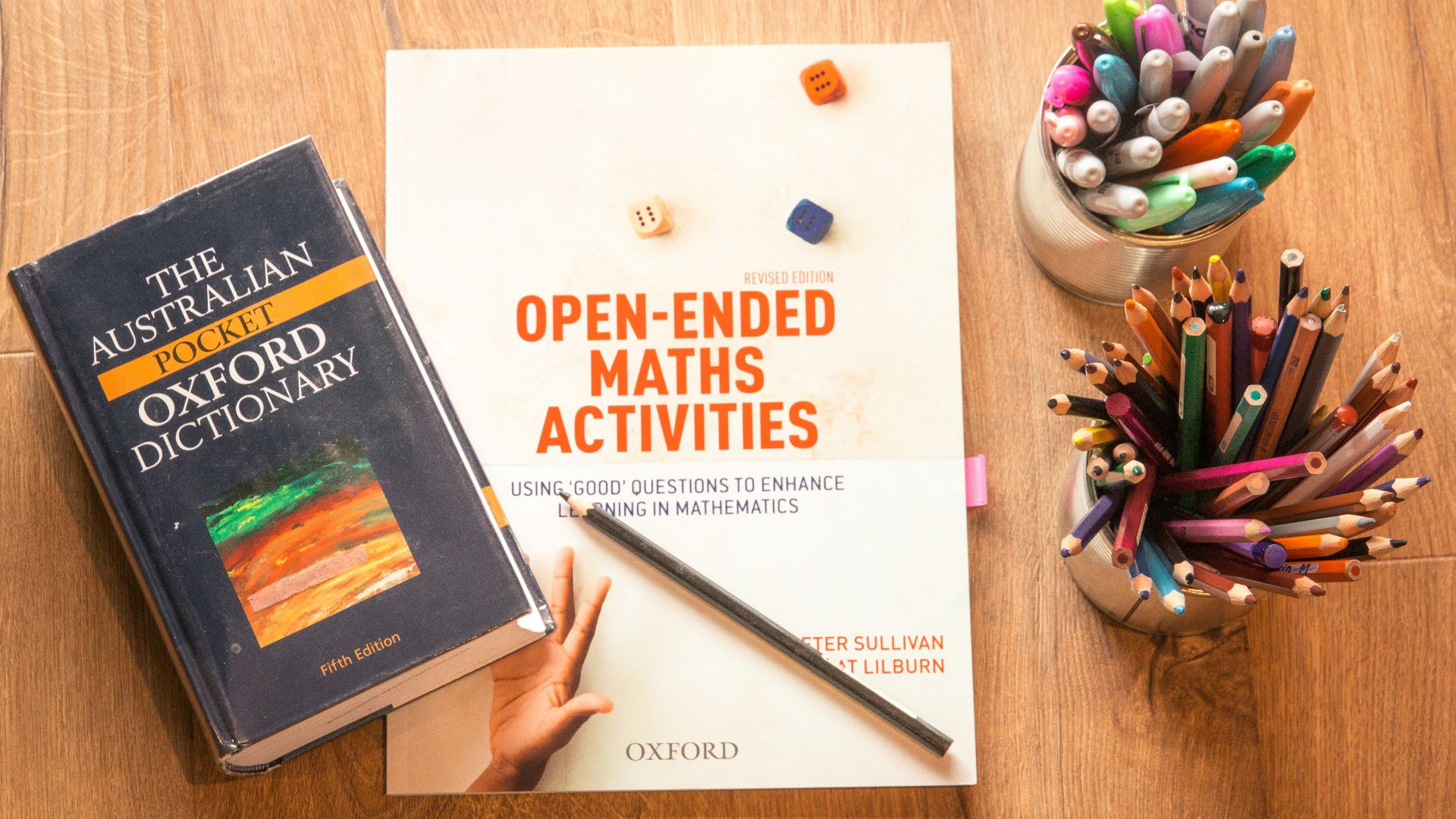 person holding a book and pen