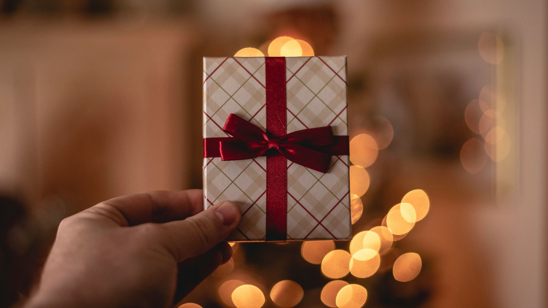 person holding white gift card