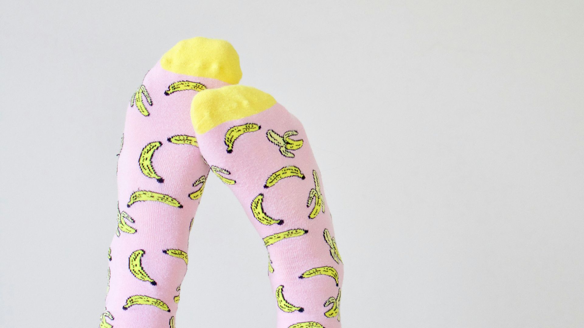 pair of pink-and-yellow socks