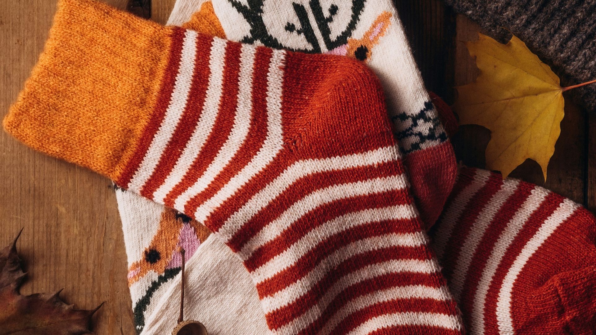 a pair of socks and a hat on a wooden table