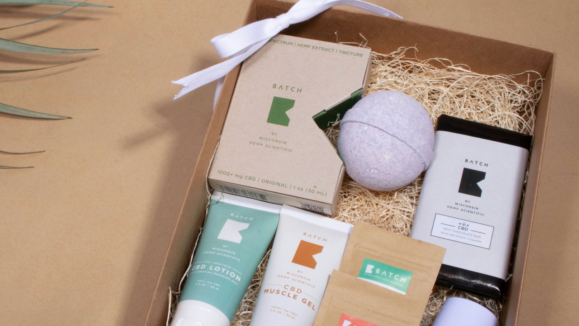 white and brown labeled soft tubes in box