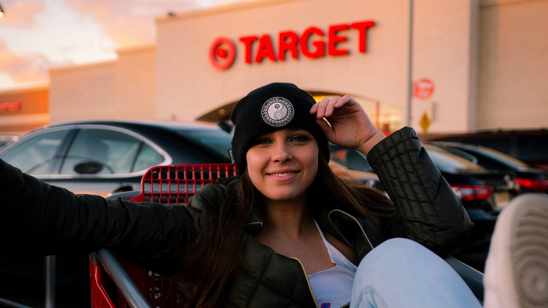 woman in black sunglasses sitting on red chair