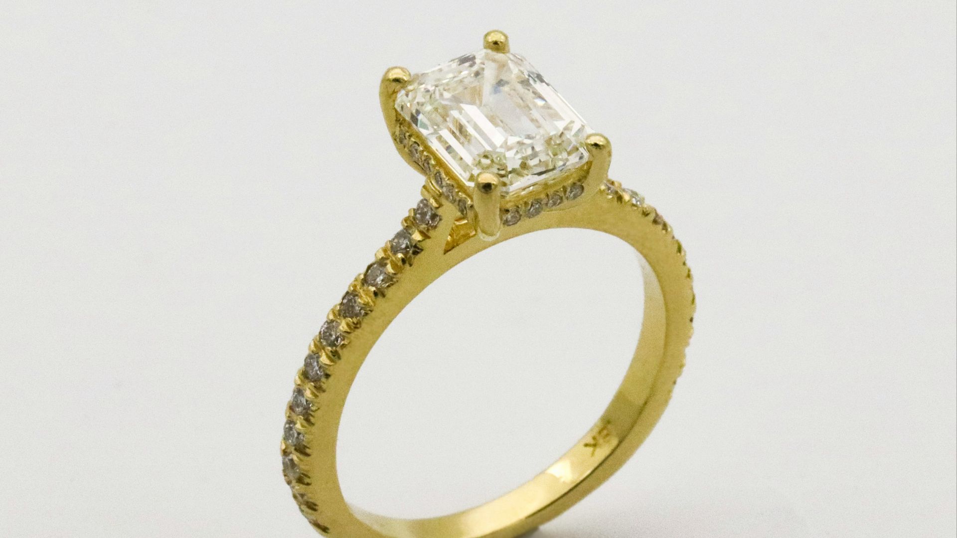 gold ring on white surface