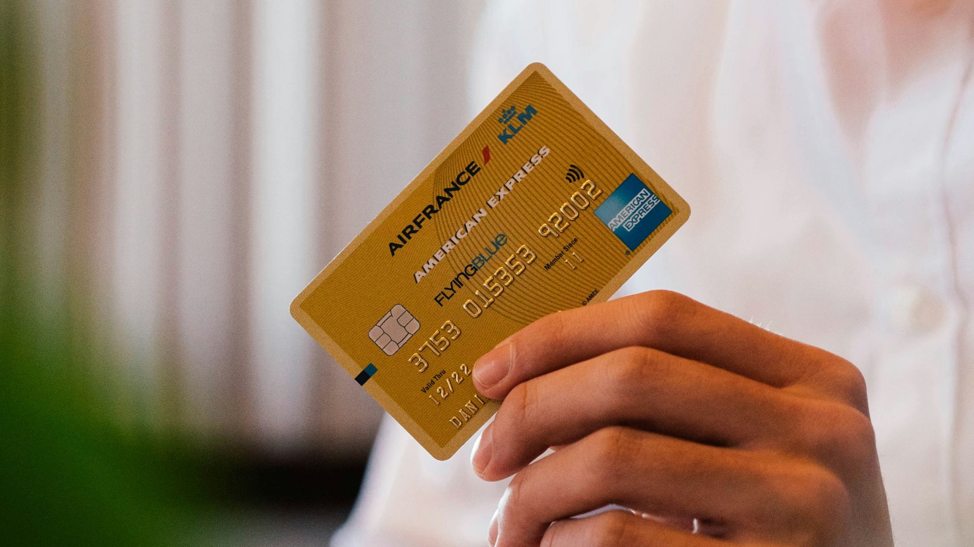 person holding credit card