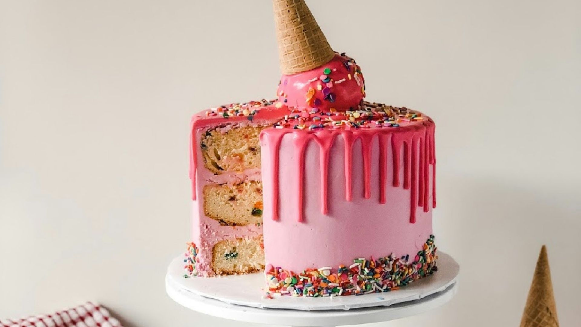 pink and white cake on white ceramic plate