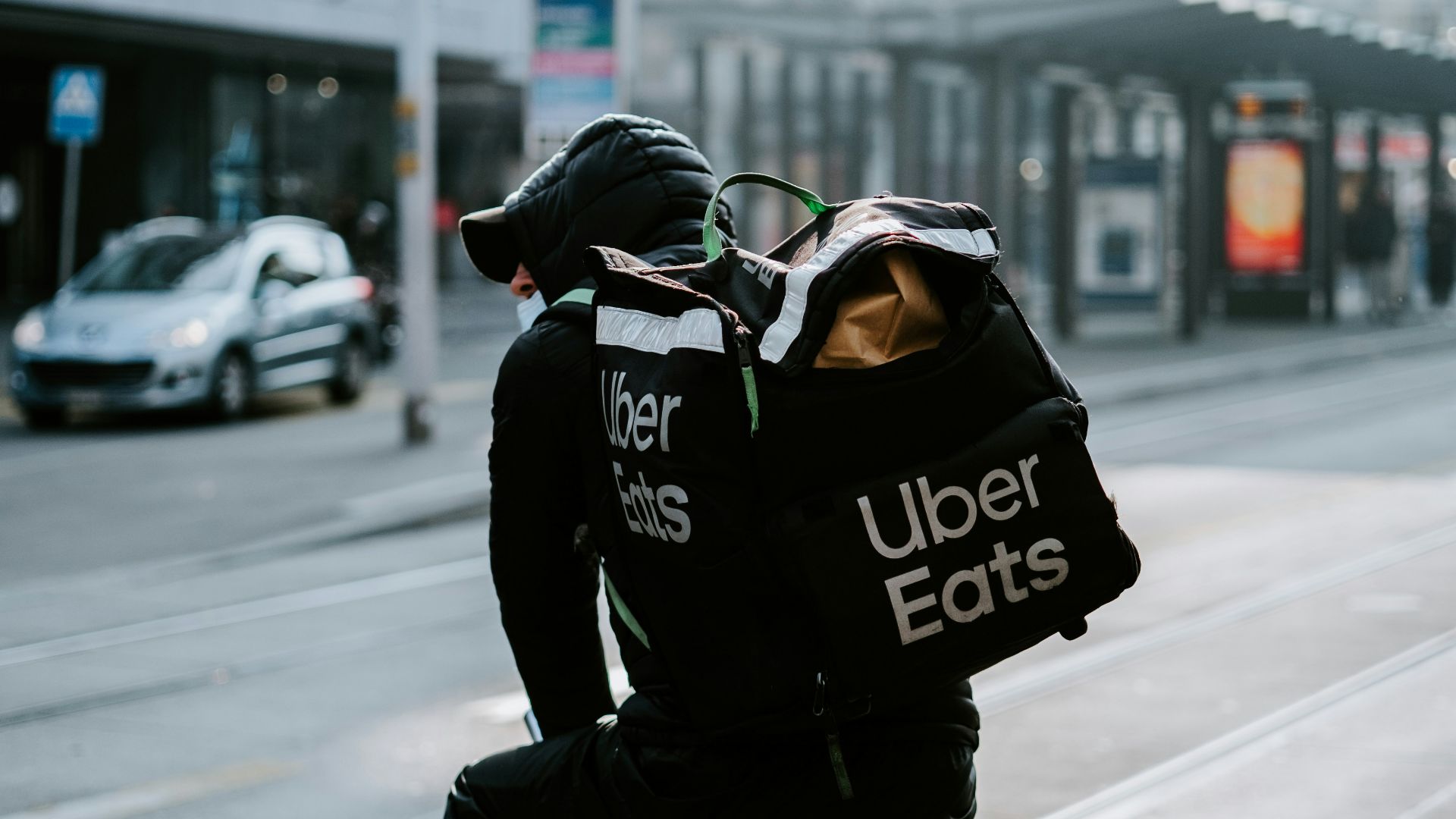a person riding a bike on a city street