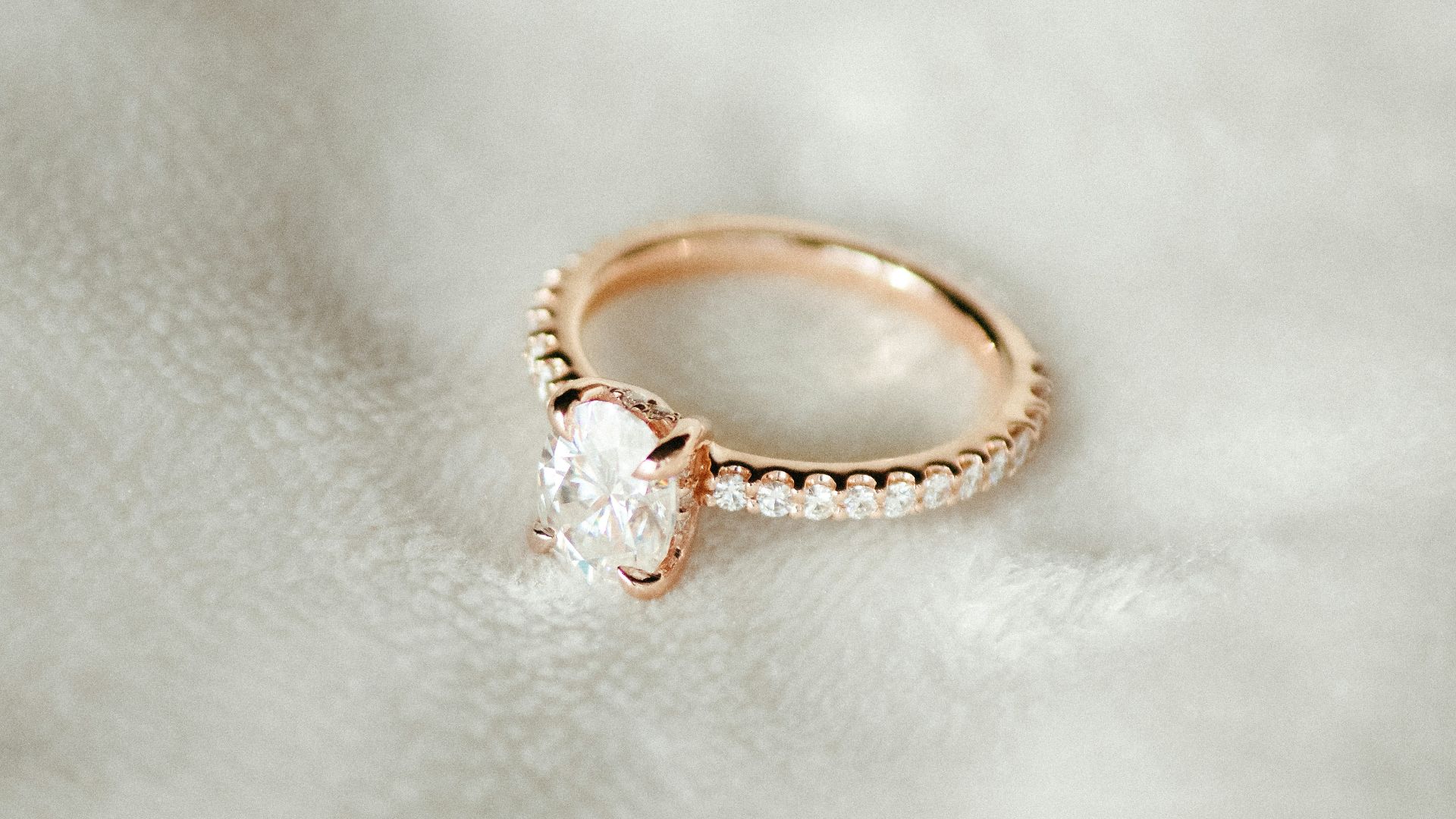 A close up of a ring on a white cloth