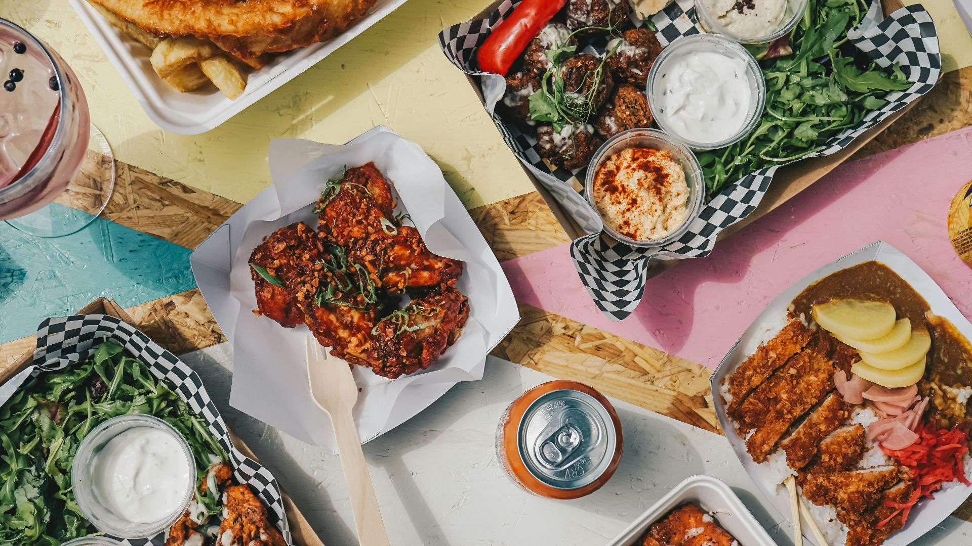 a table topped with plates of food and drinks