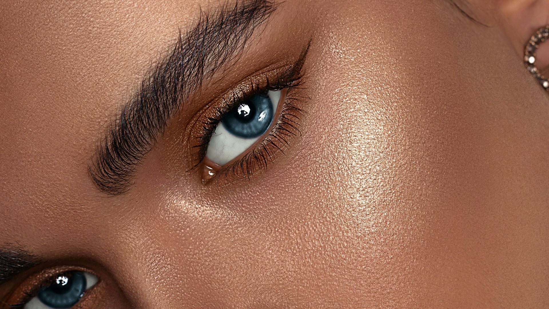 woman with red lipstick and gold hoop earrings