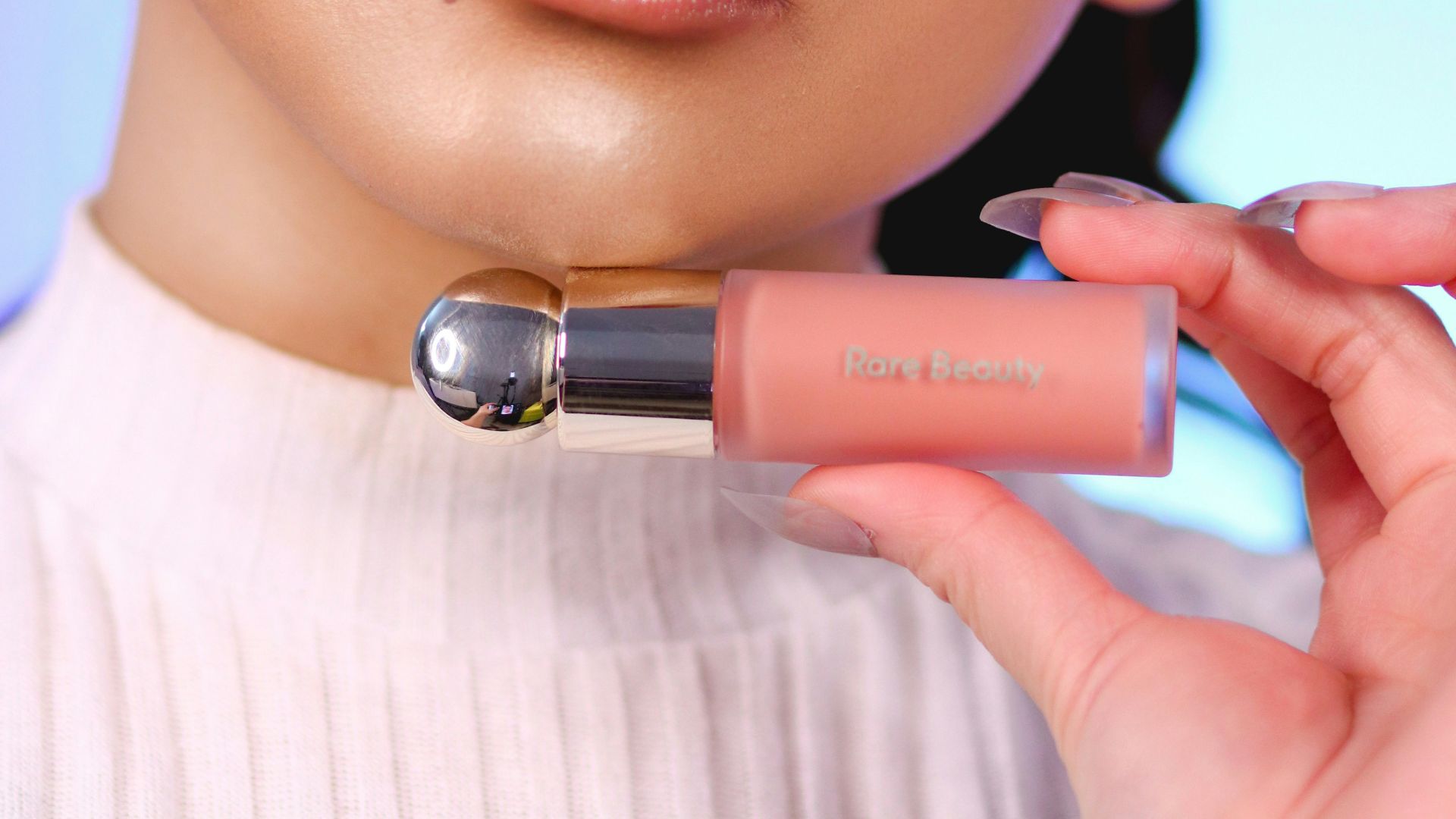 woman with pink lipstick and white shirt