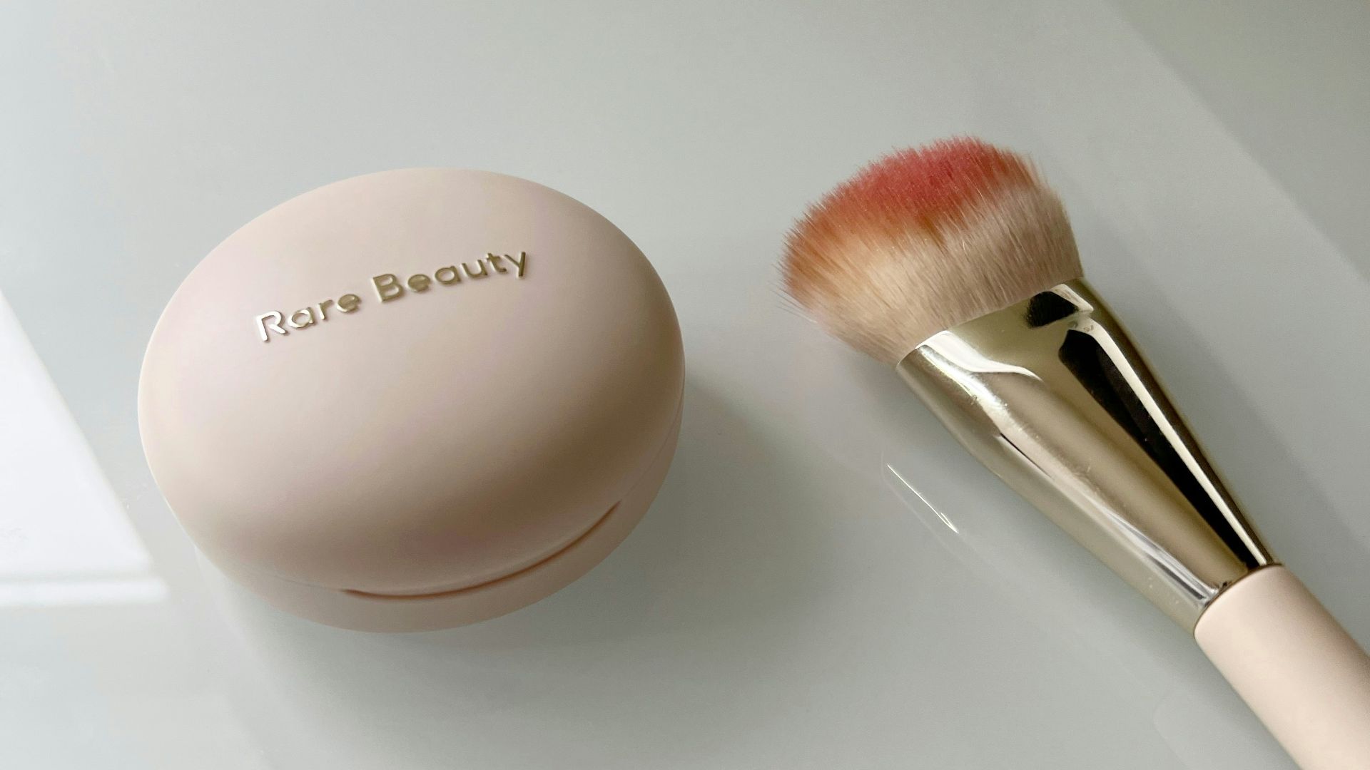 A brush and a powder on a table