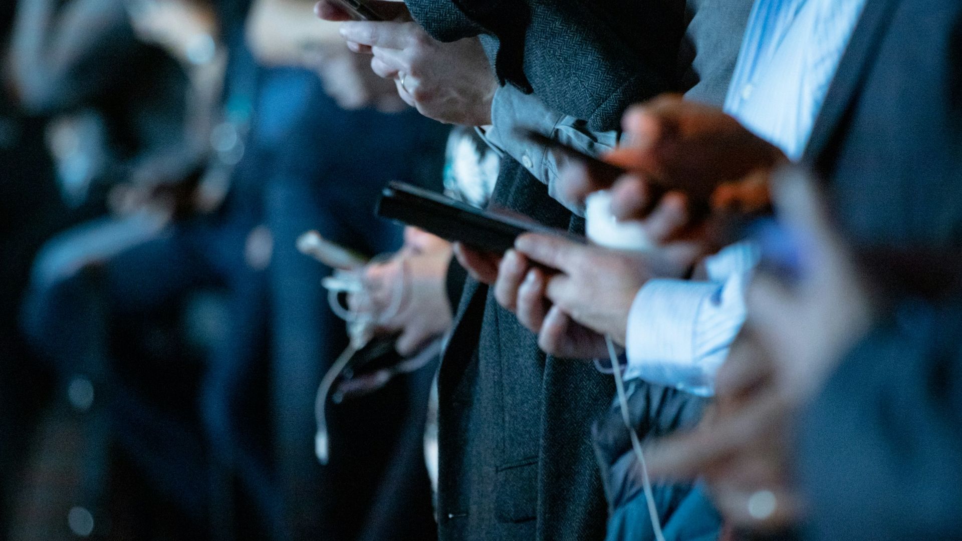 people using phone while standing