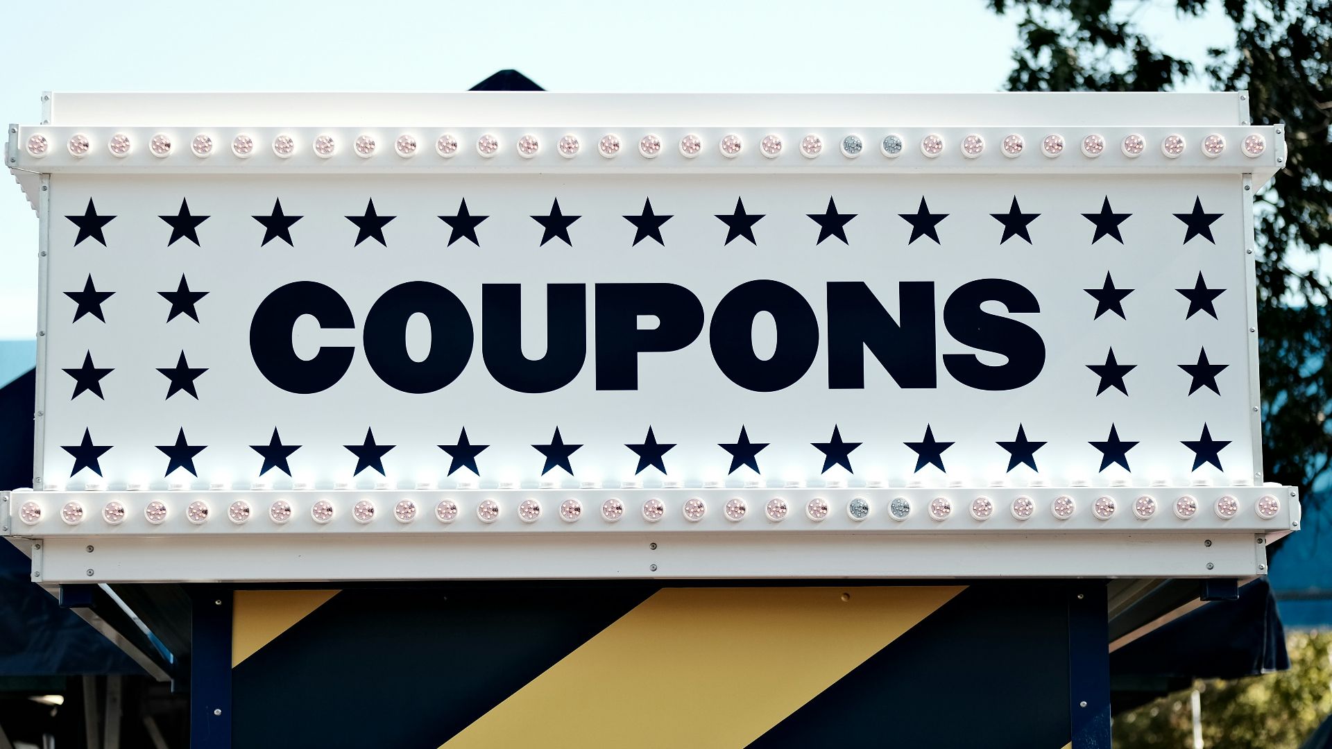 a sign that says coupons on it