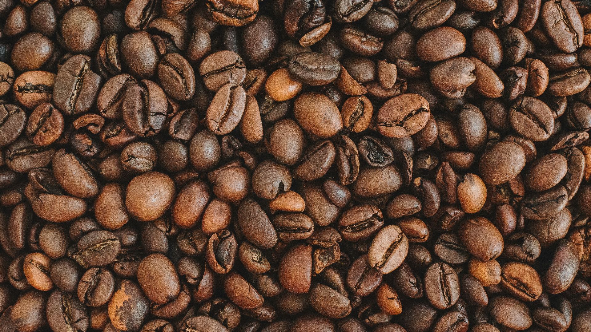 brown coffee beans on brown wooden table