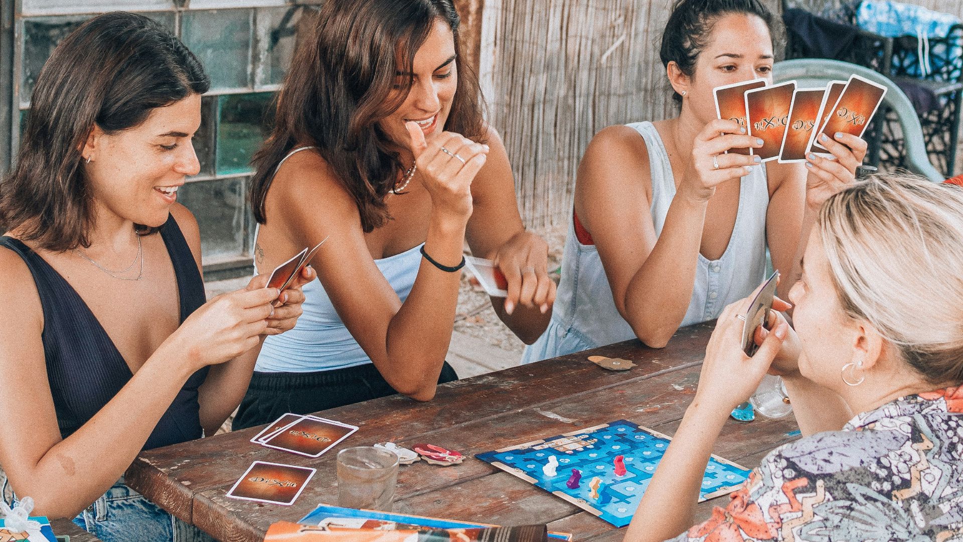 a group of people sitting at a table eating food