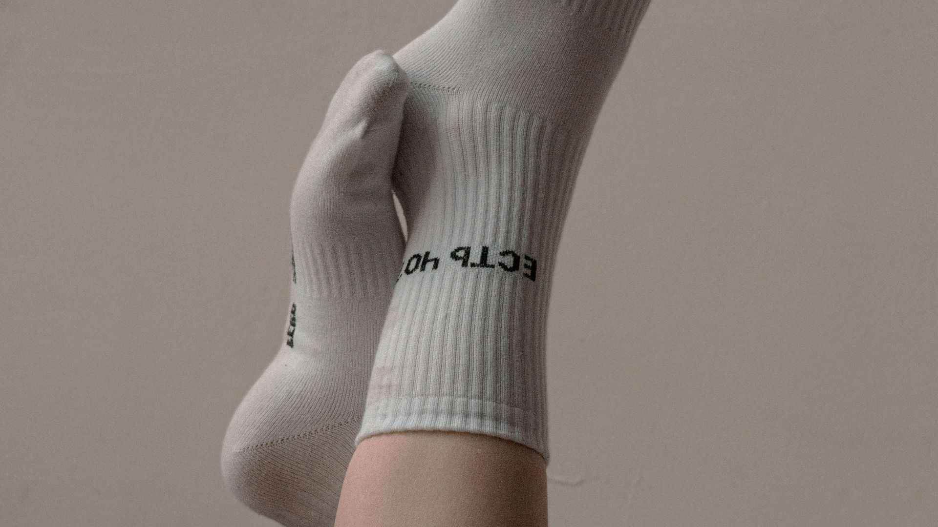 person wearing white nike sock