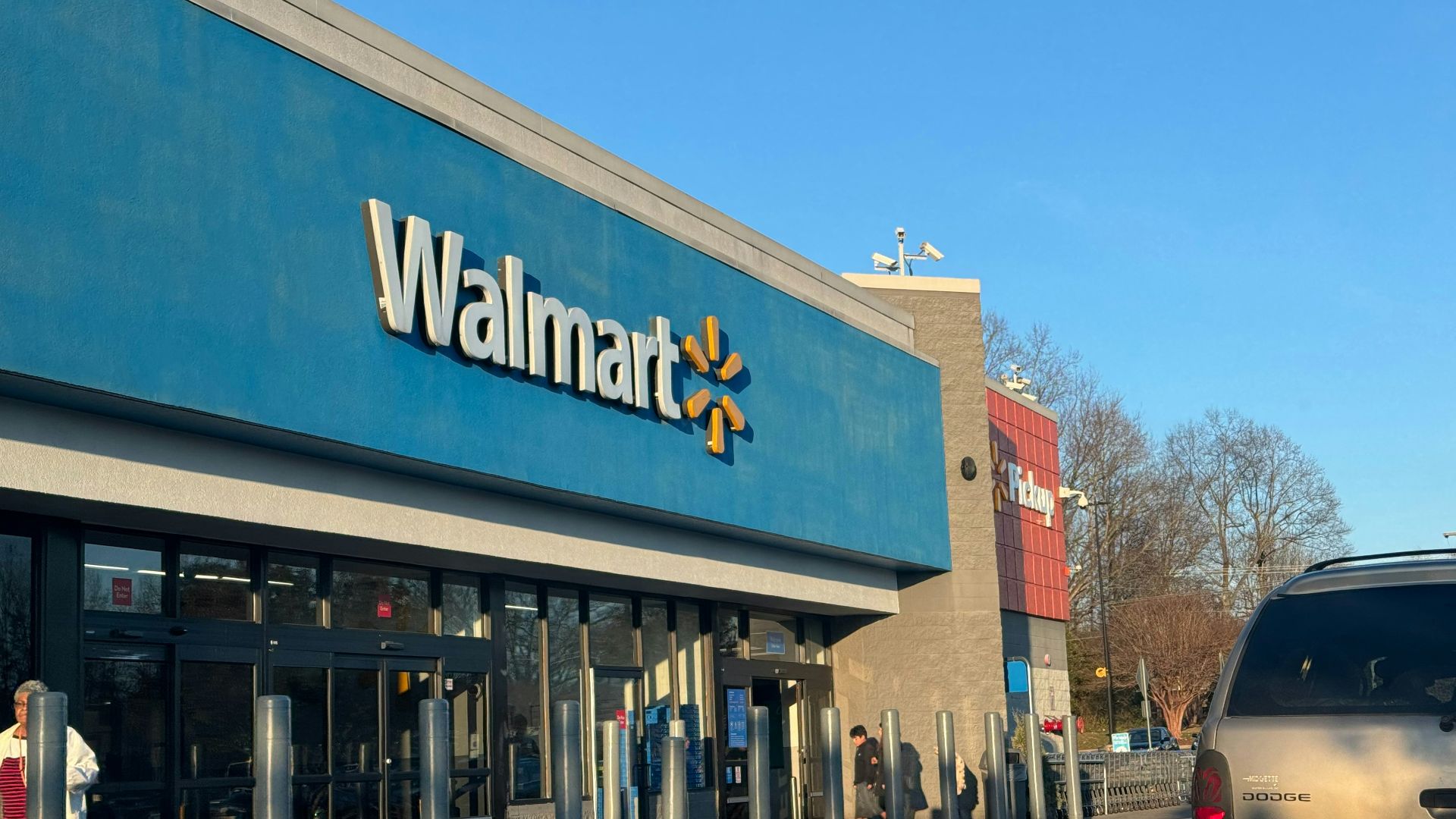 a walmart store with a car parked in front of it