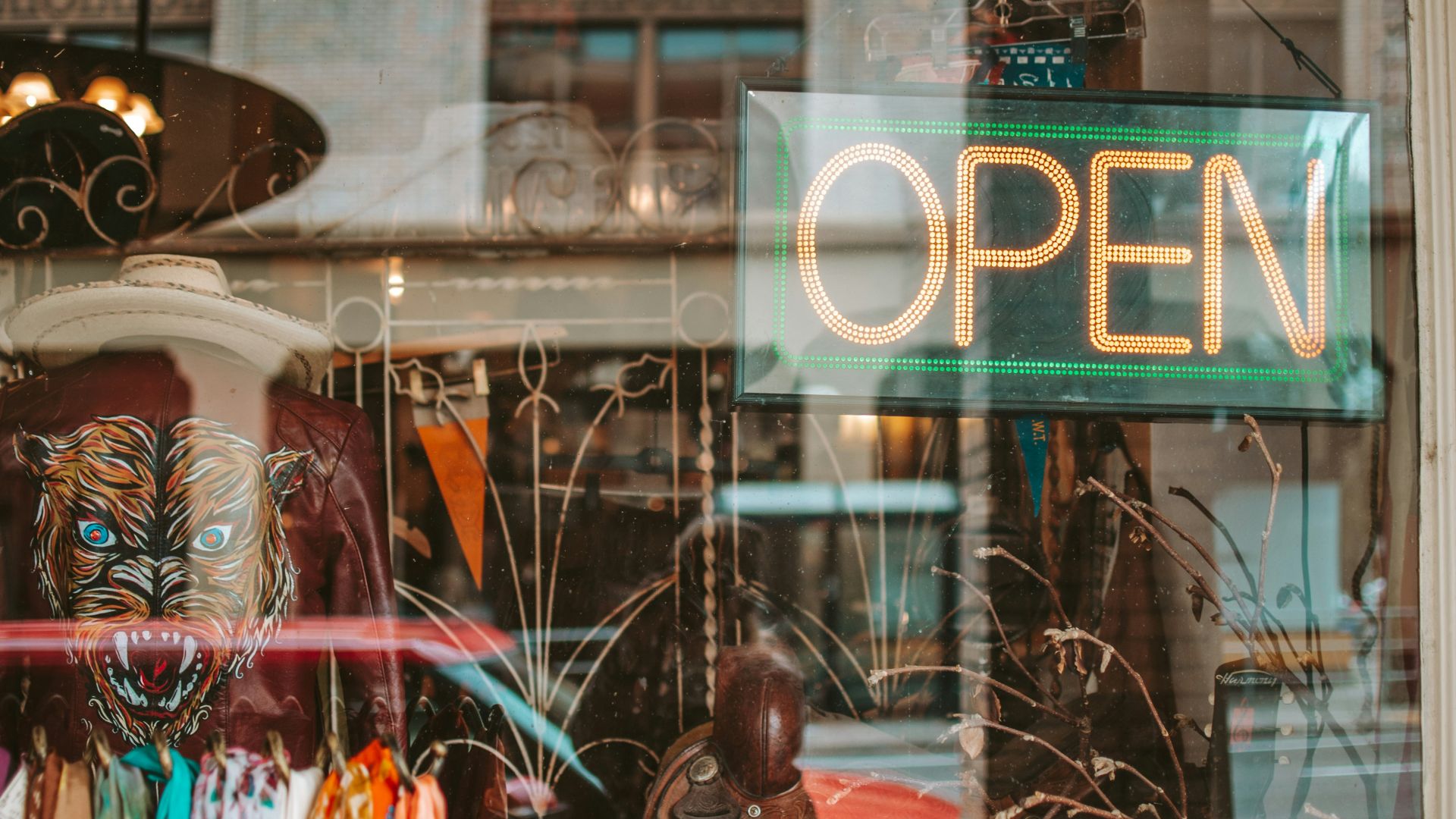 woman in red dress sitting on black metal bench
