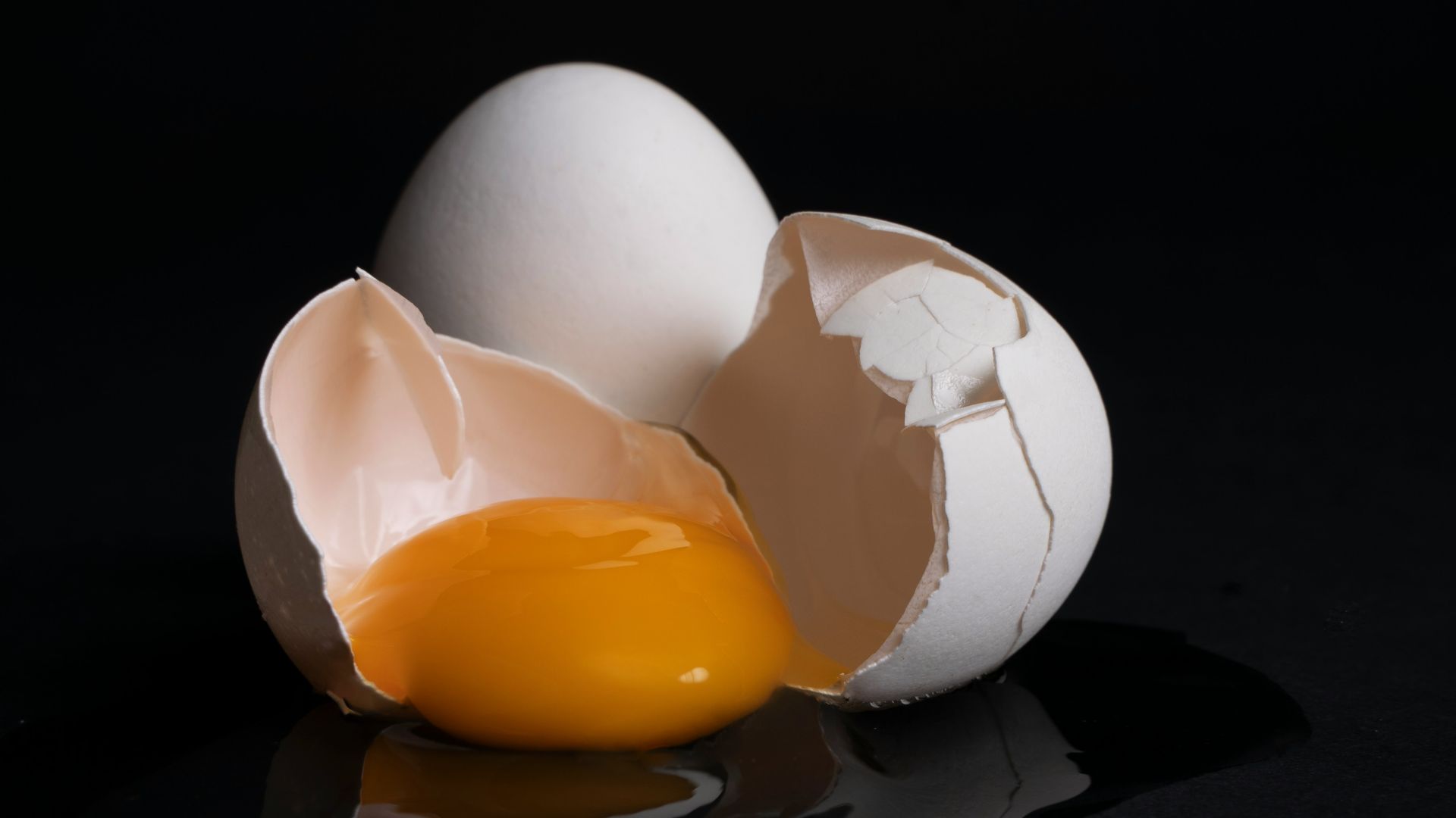 white egg on brown wooden tray