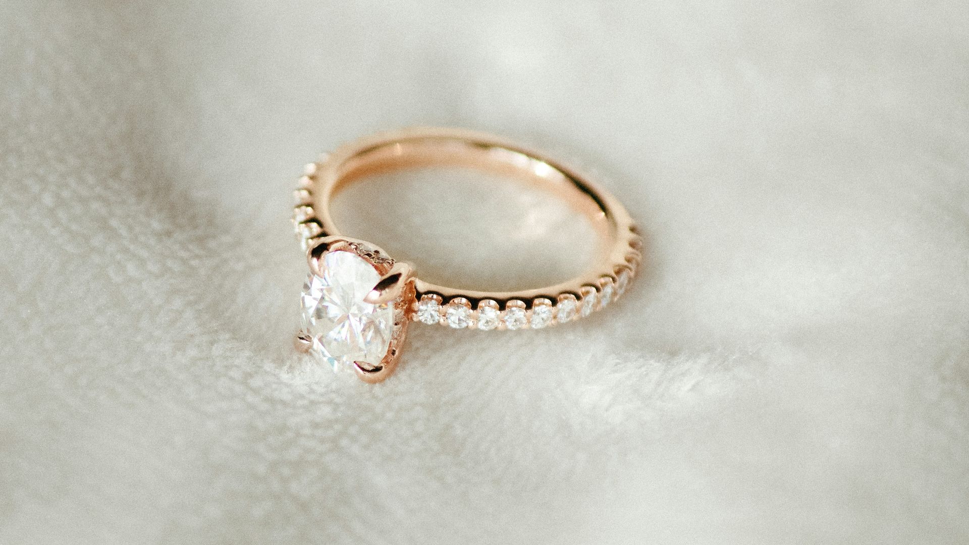 A close up of a ring on a white cloth
