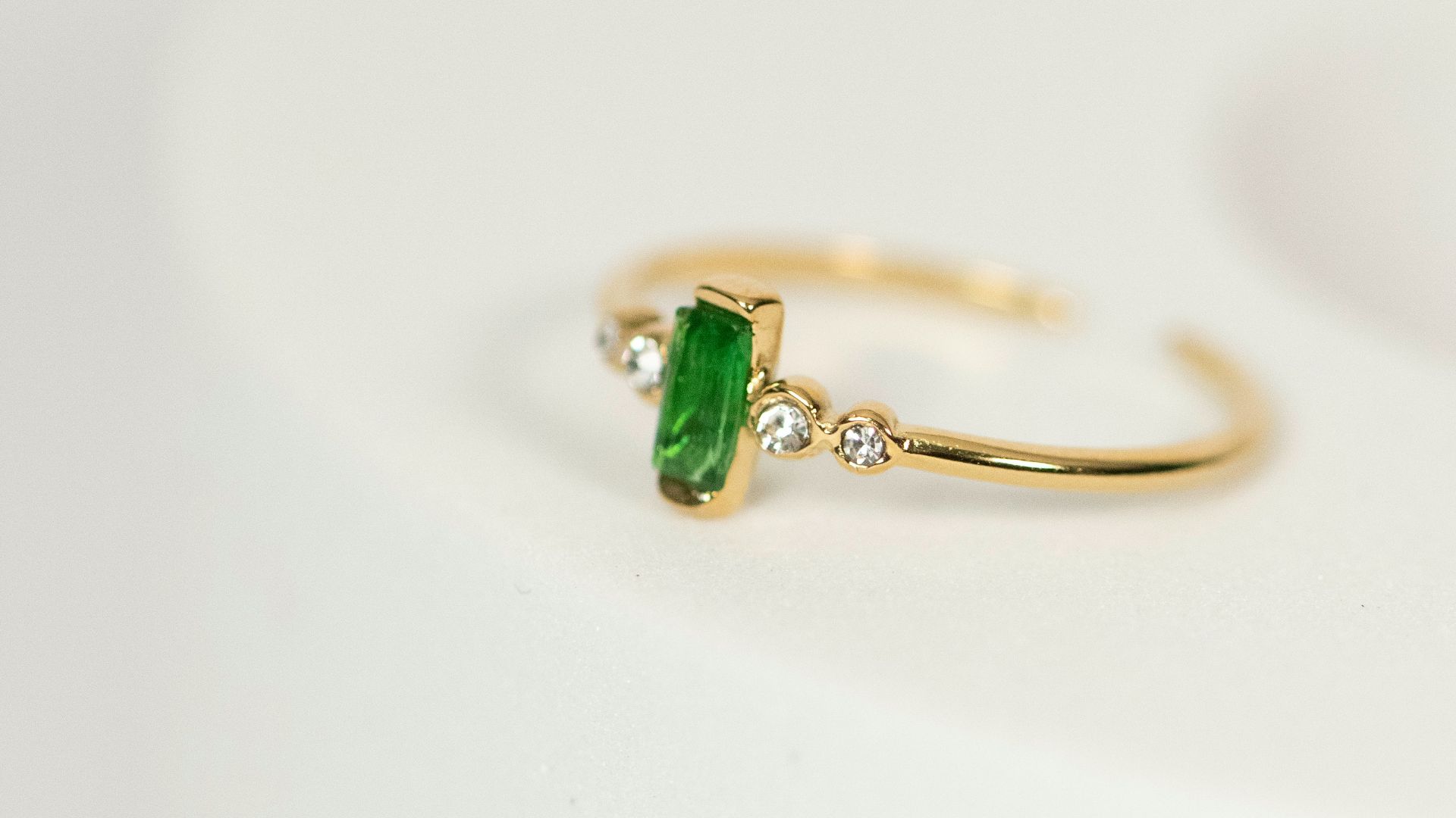 a close up of a ring on a white surface