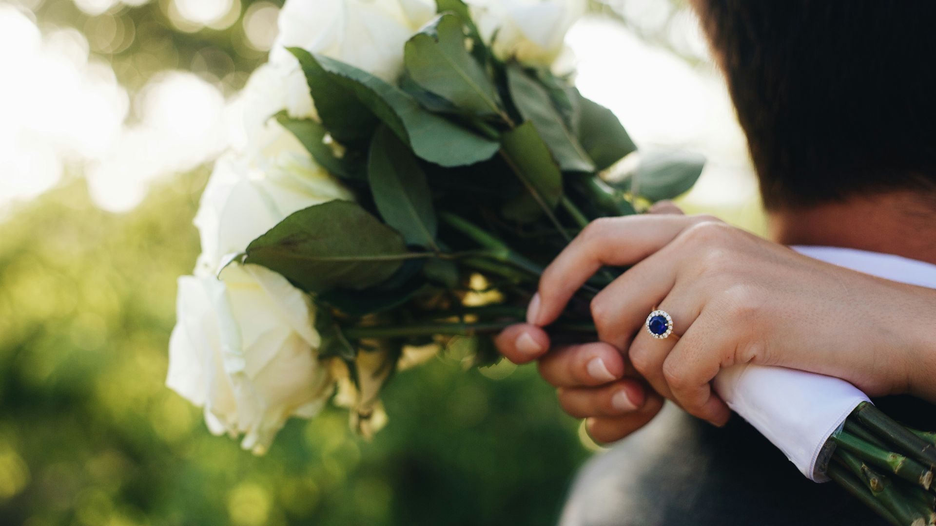 person holding white flower during daytime
