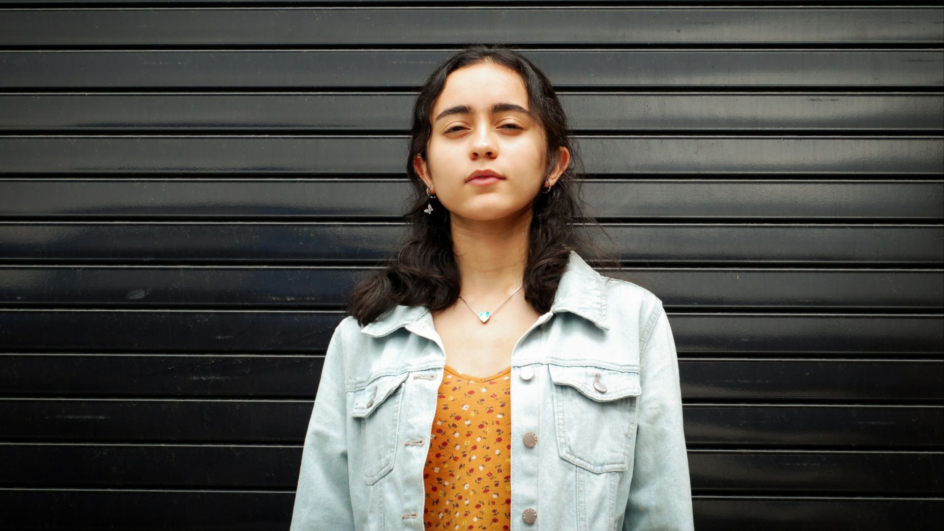 girl wearing white denim jacket