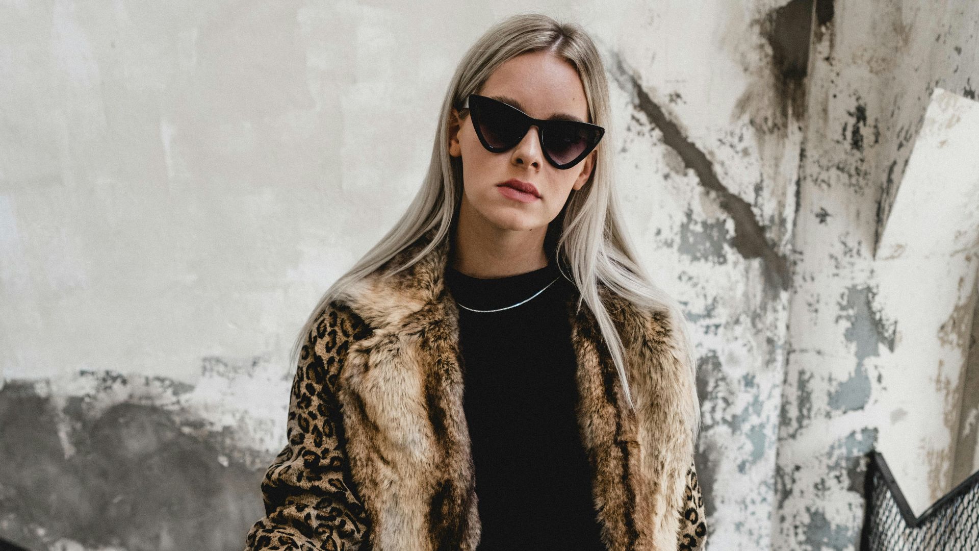 woman standing on gray stairs