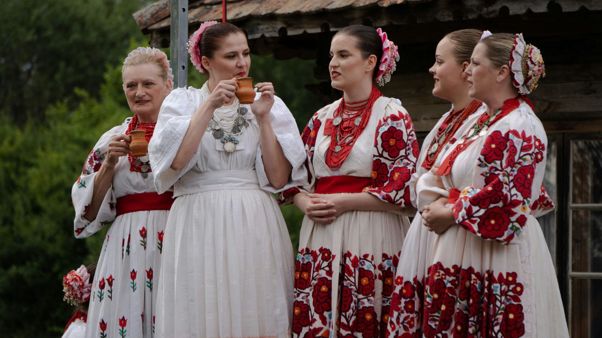 a group of women standing next to each other