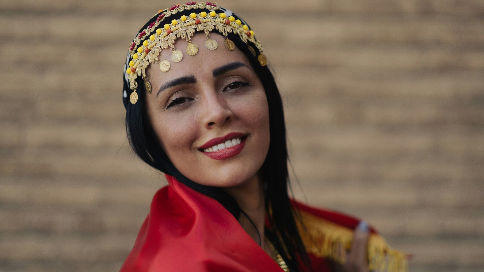 woman in red dress wearing gold crown
