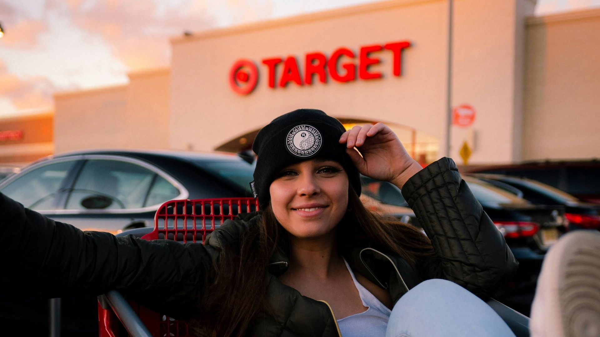 woman in black sunglasses sitting on red chair