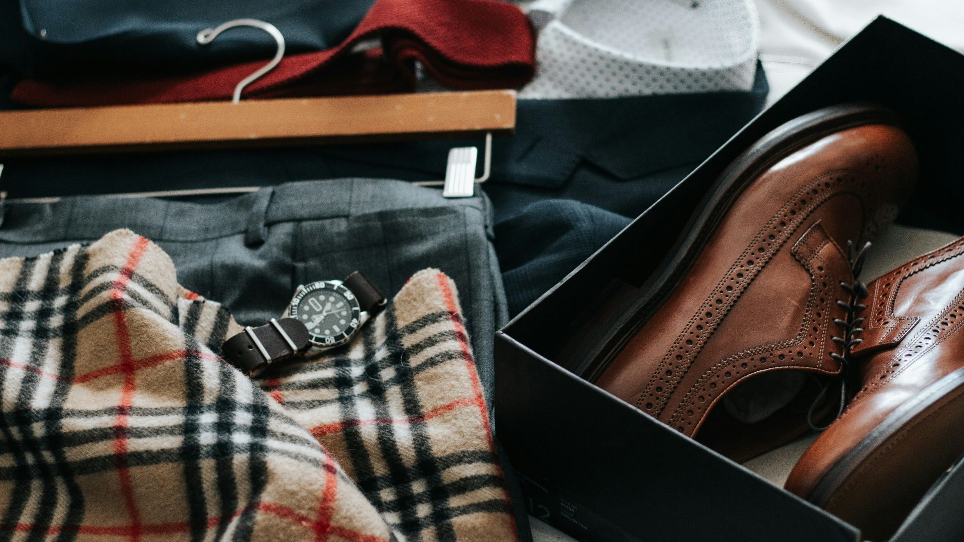 pair of brown leather dress shoes with box