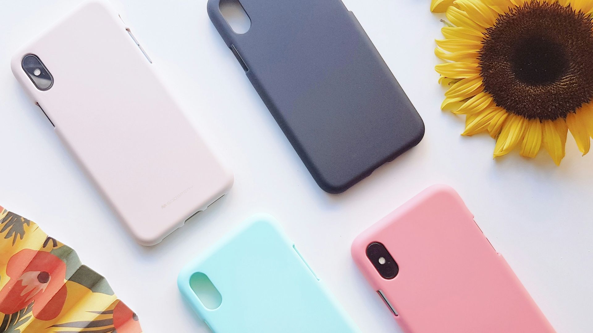 four assorted-color iPhone X cases