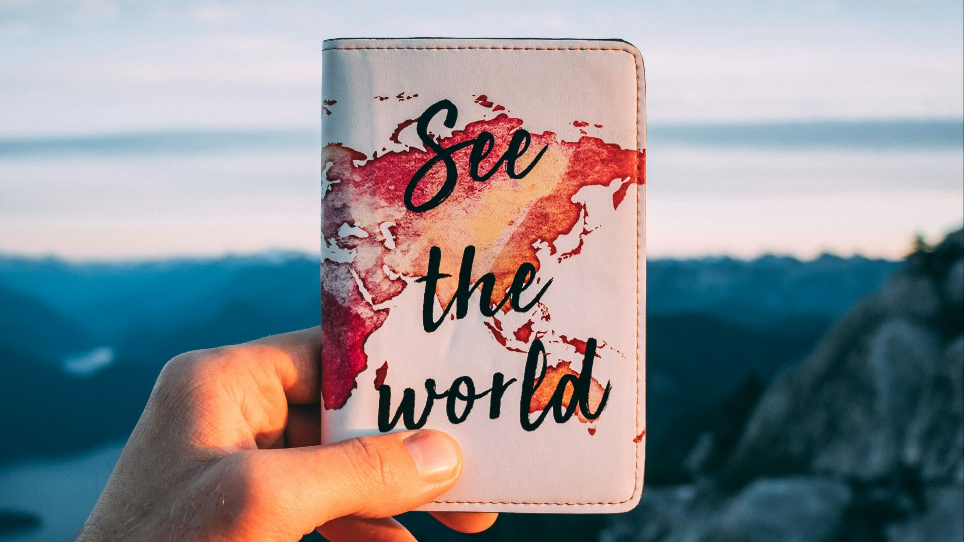 person holding white pocketbook