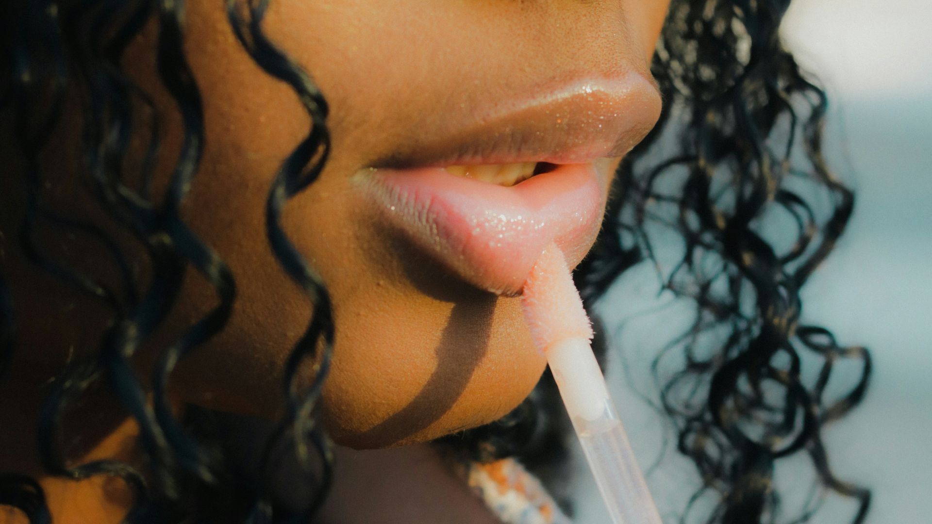 a close up of a person holding a toothbrush