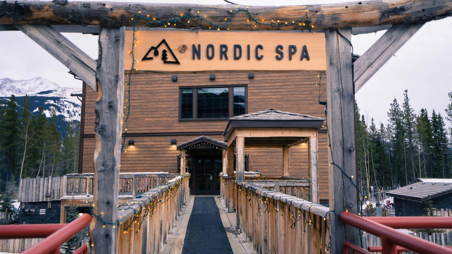 a wooden building with a sign on it