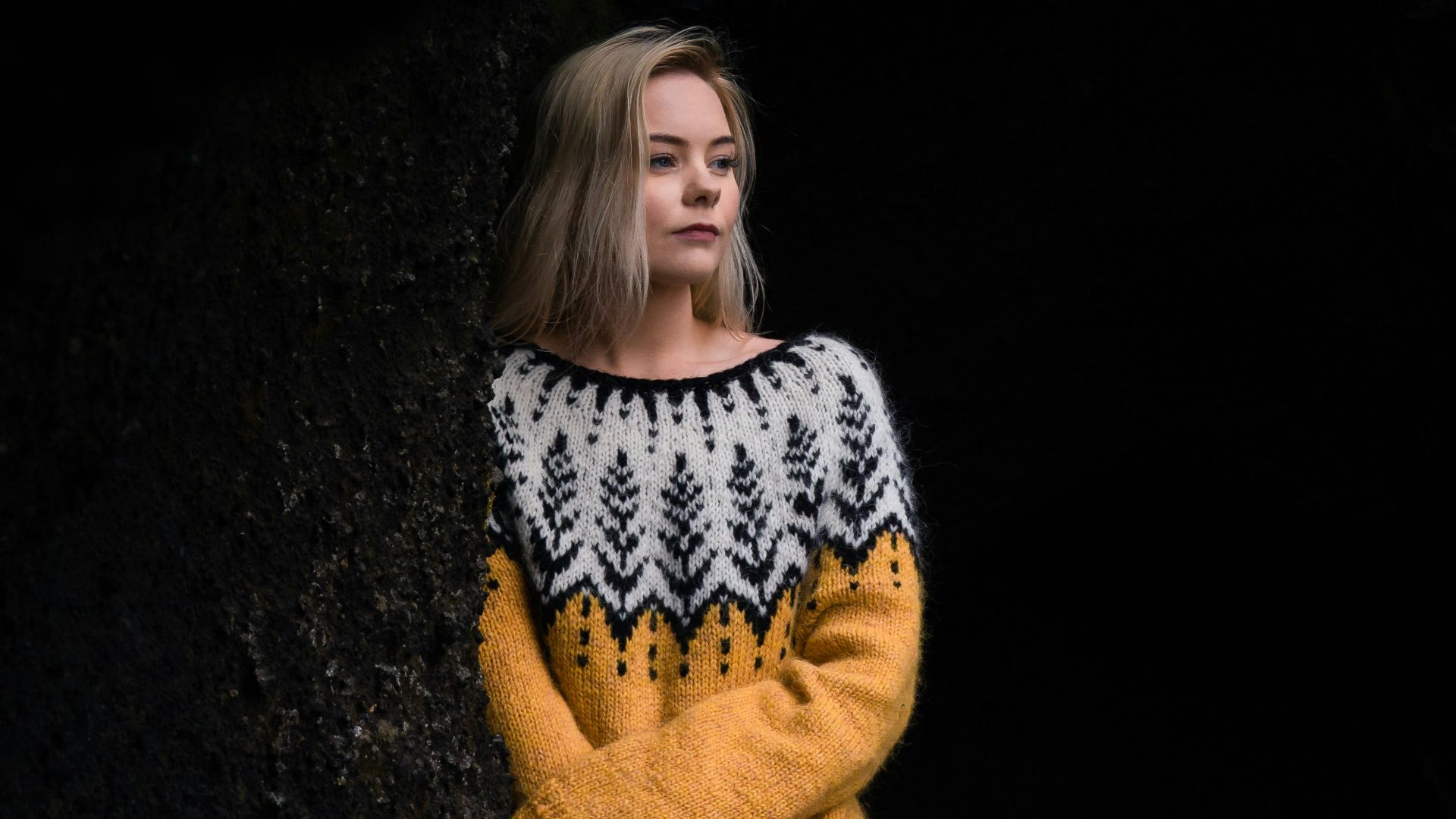 woman in black and white long sleeve shirt and brown coat