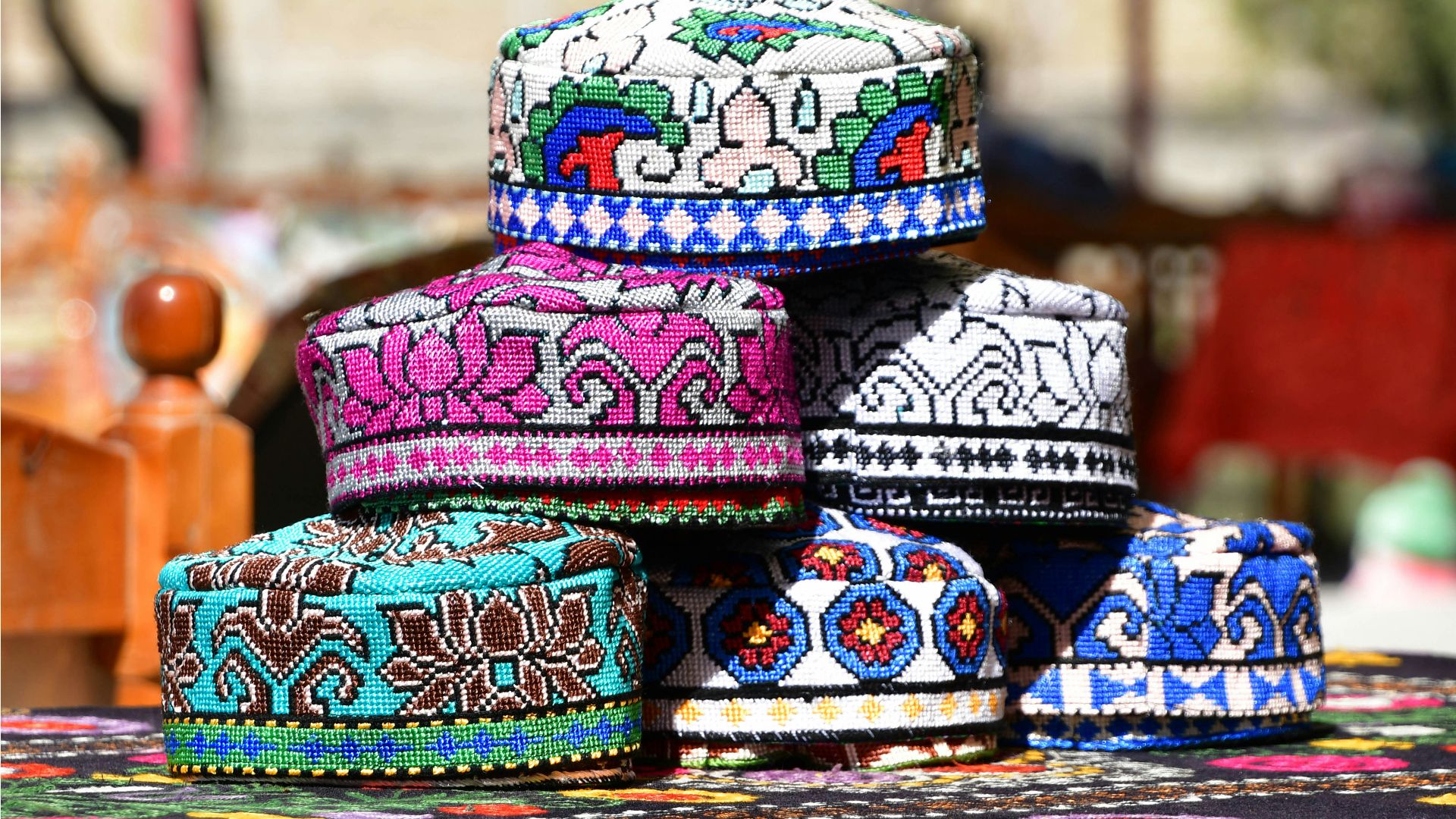 a group of colorful hats sitting on top of a table
