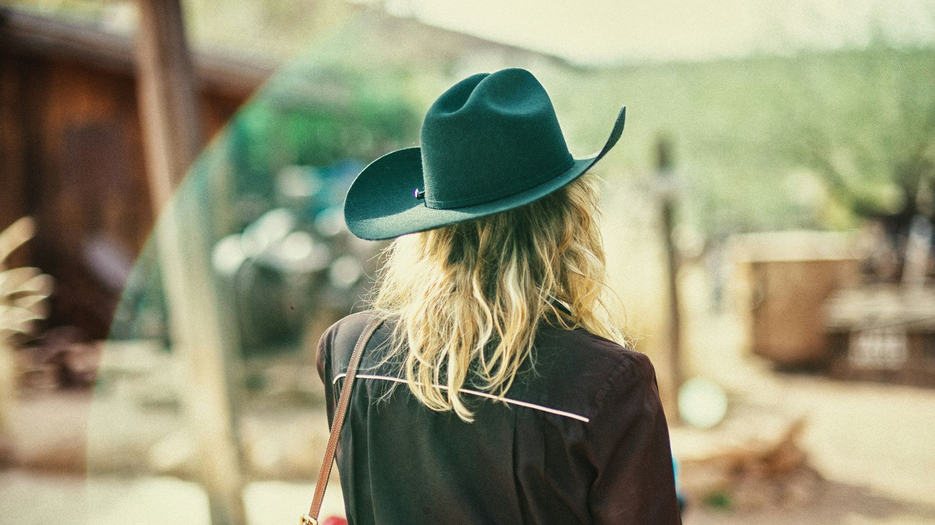 woman wearing black cowboy hat