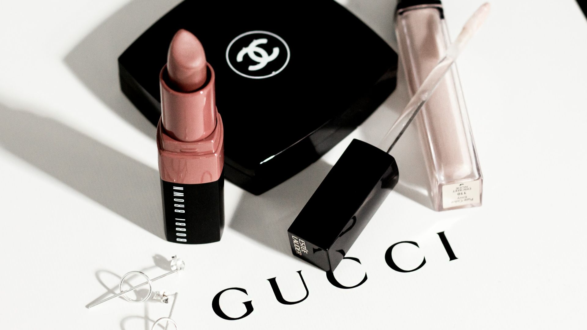 black and pink lipstick and black eyeshadow palette