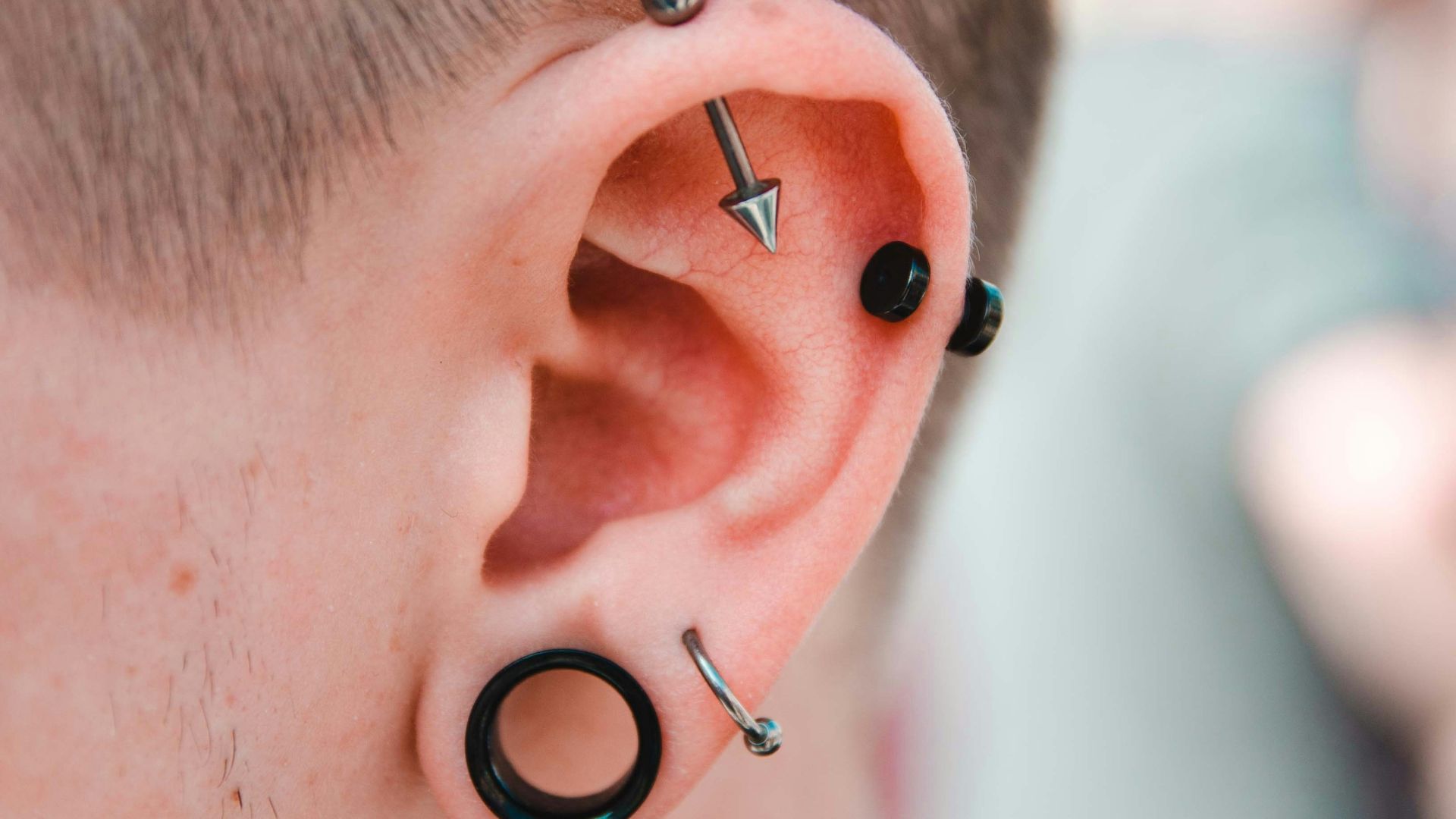 person wearing stud earrings