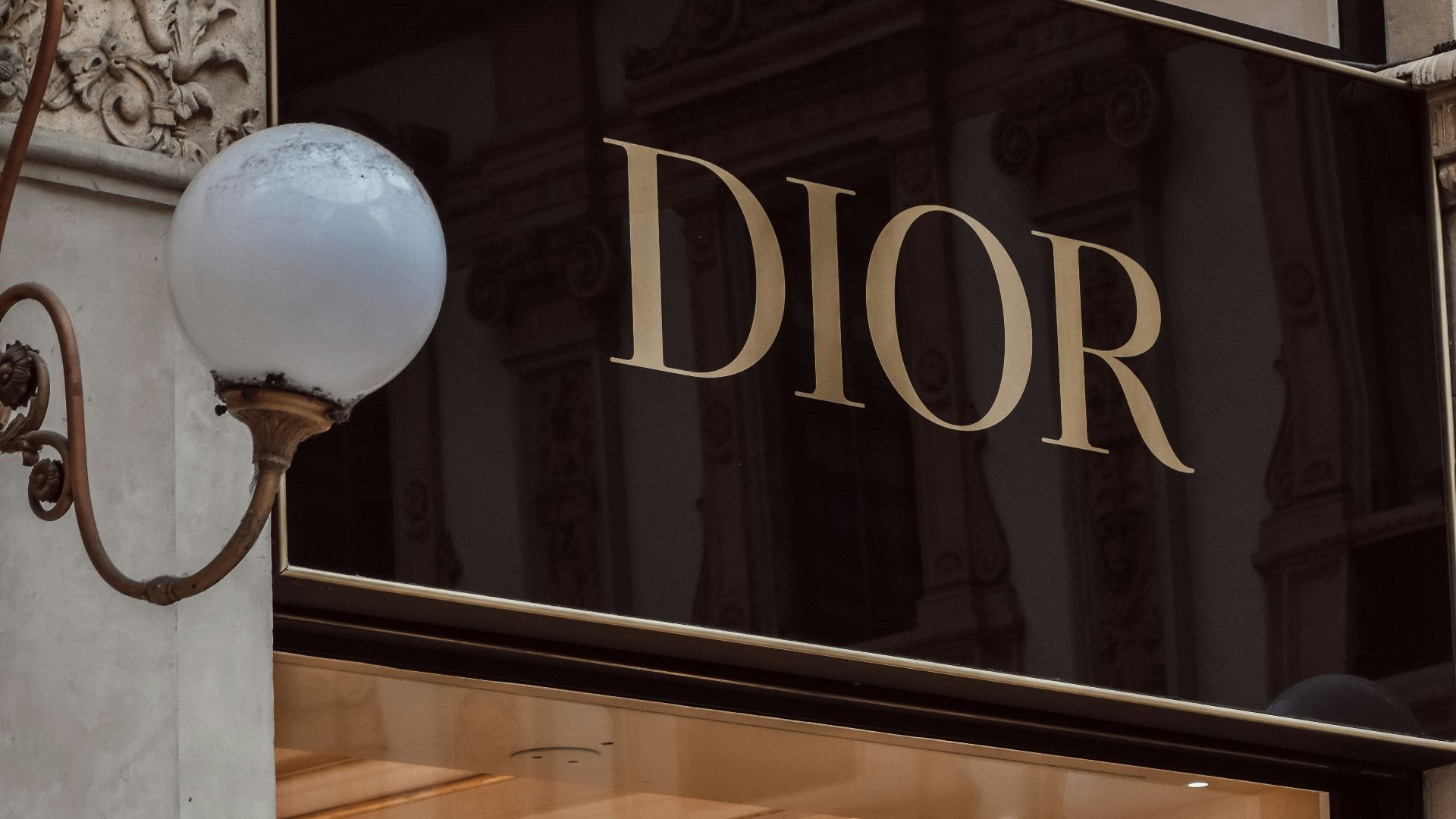 a large glass door with a large white ball in front of it