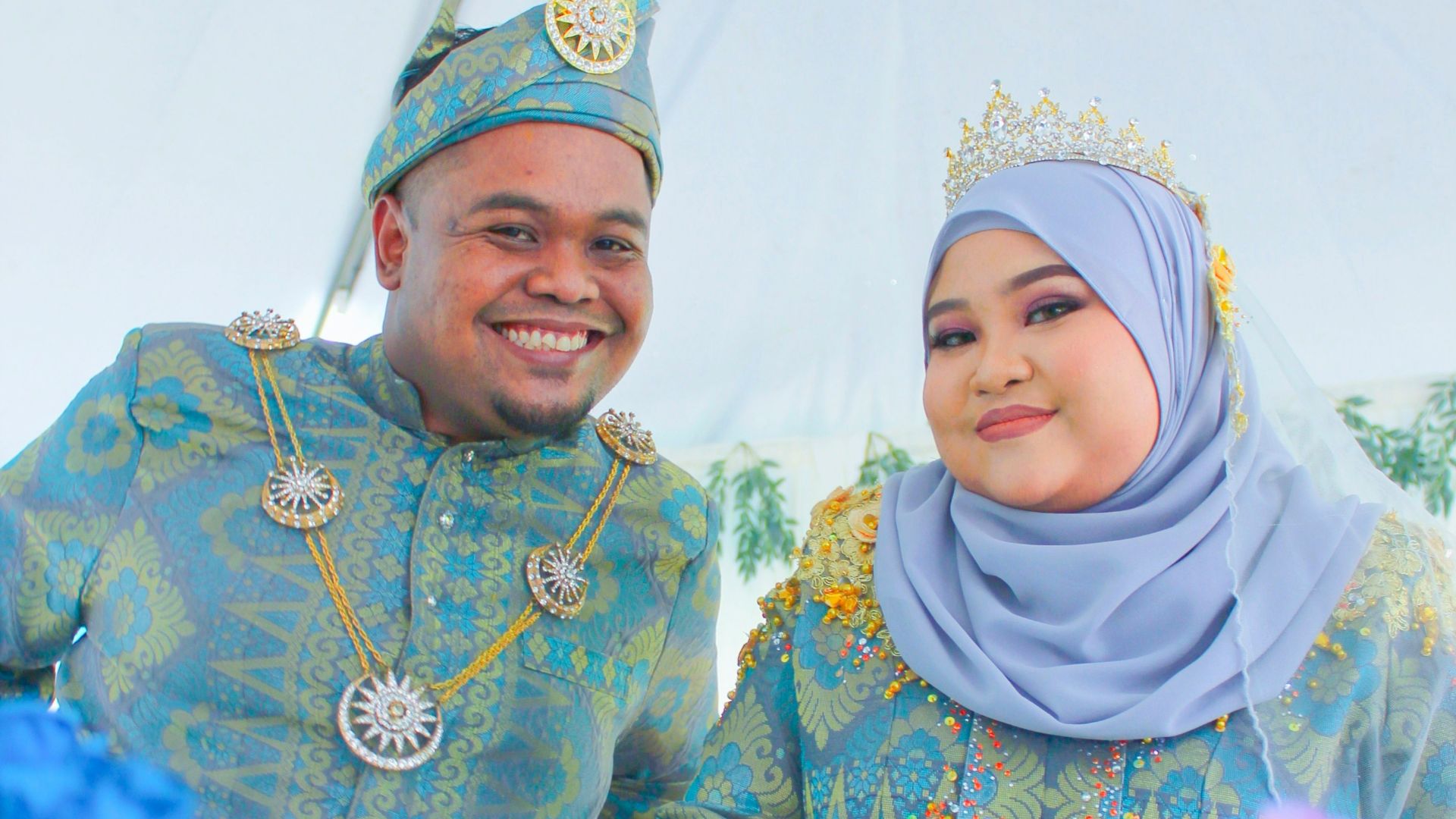 a man and a woman dressed in traditional clothing