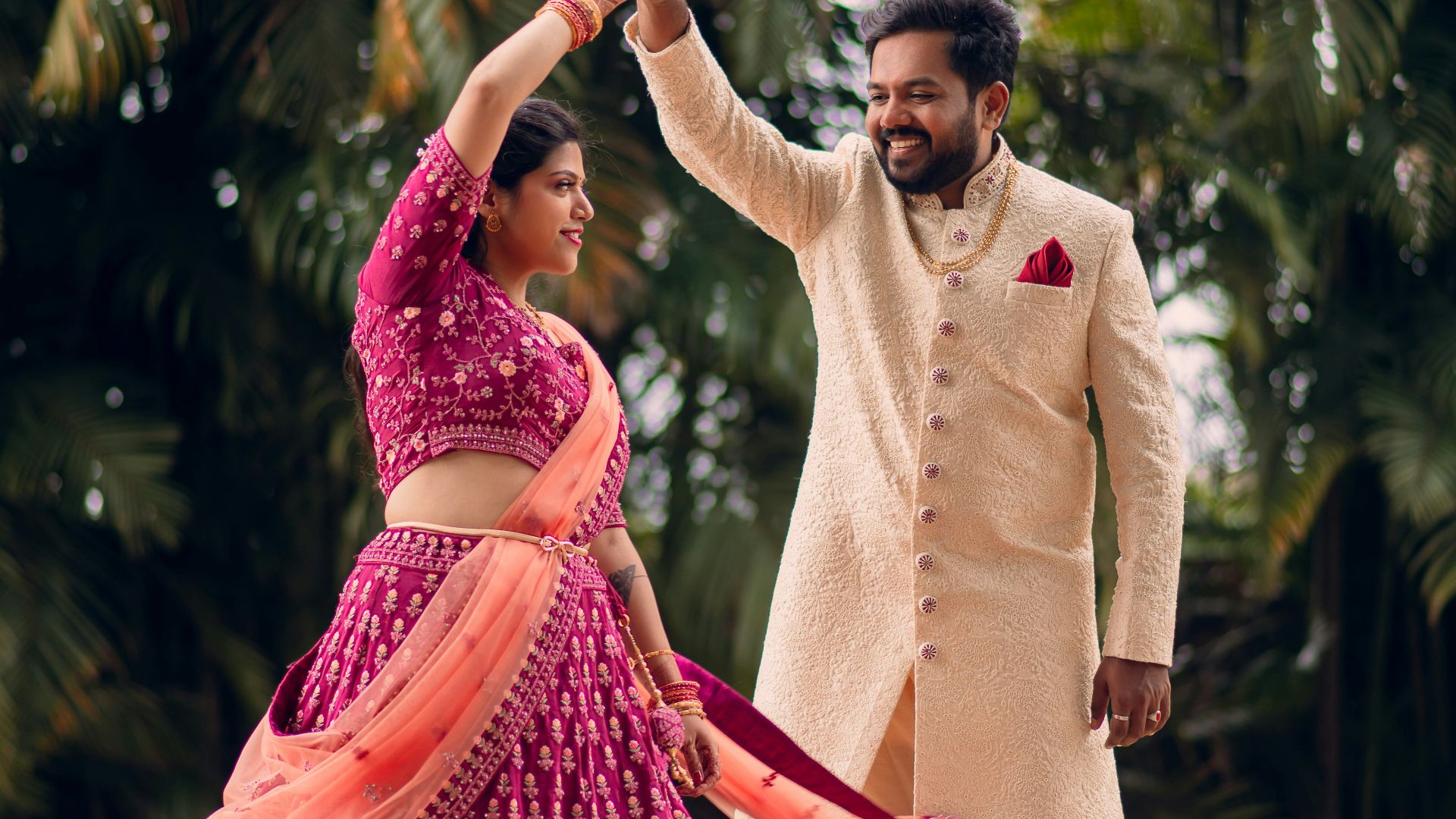a man and a woman dancing in a field