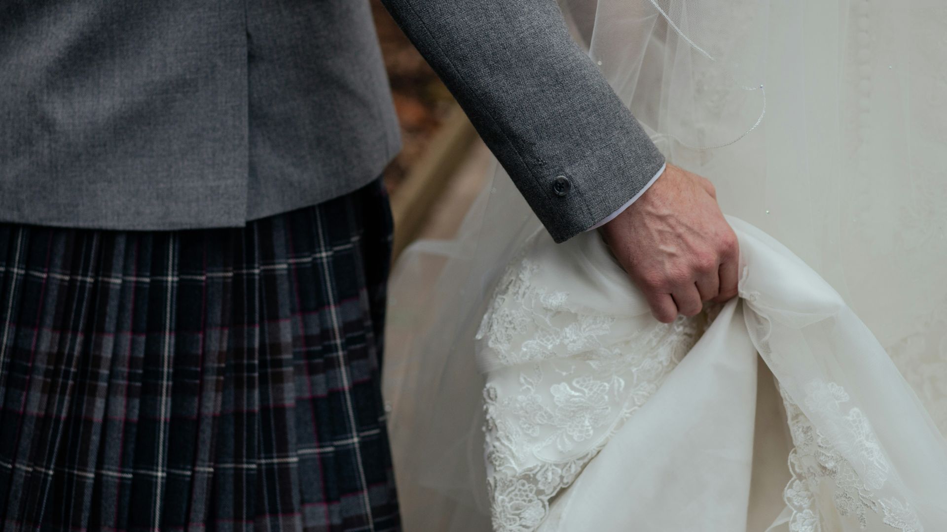 person holding white wedding gown